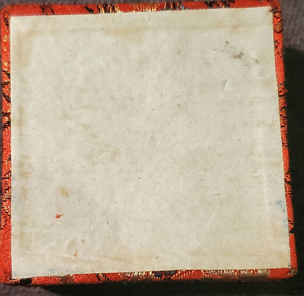 Chinese gilded medal token in souvenir fabric red box