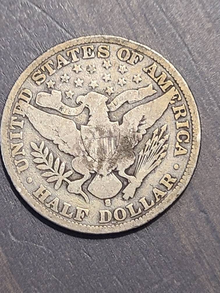 Barber half dollar silver coin. Random date 50 cent piece, us coin collecting hobby