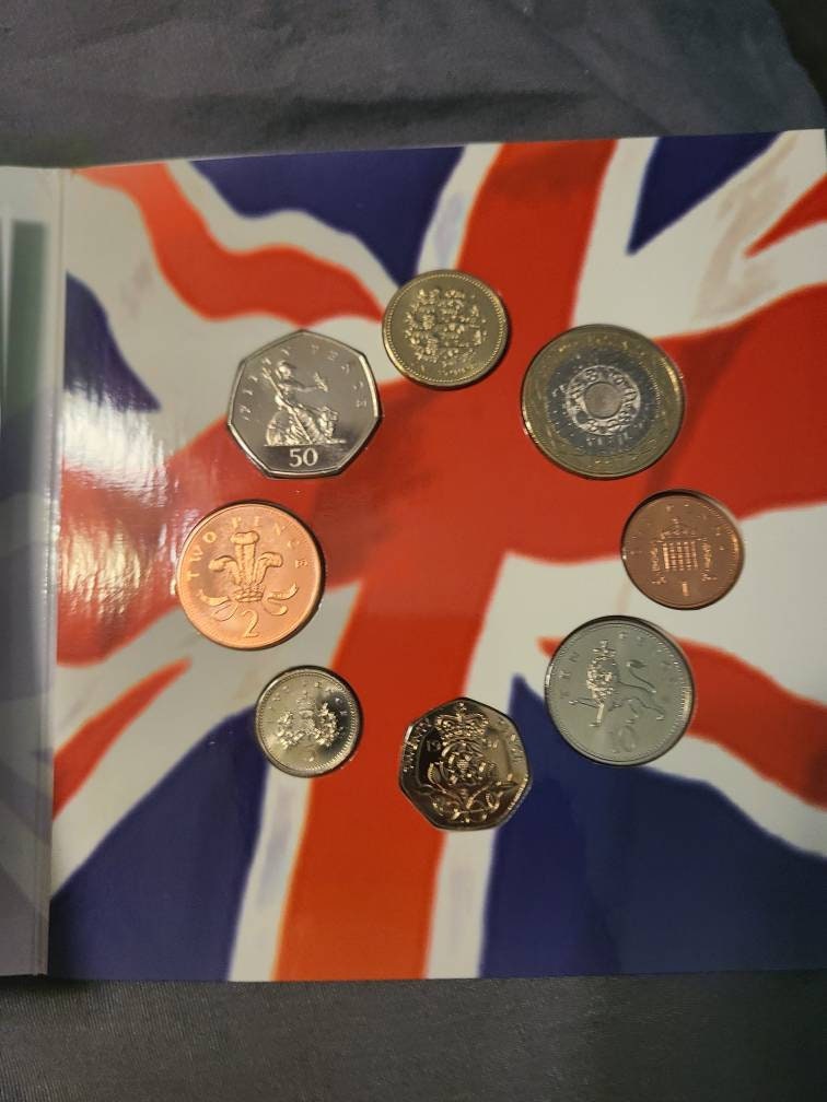 1997 united states and United Kingdom special mint uncirculated coin sets,informative multiple coin set with educational information