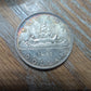 Mint state Canada silver rainbow toned dollar canoe coin