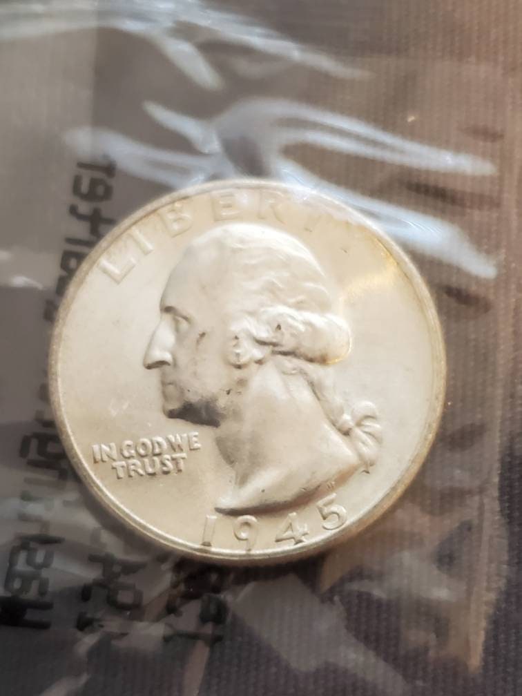 1945s earlier date silver Washington quarter choice uncirculated in Littleton plastic