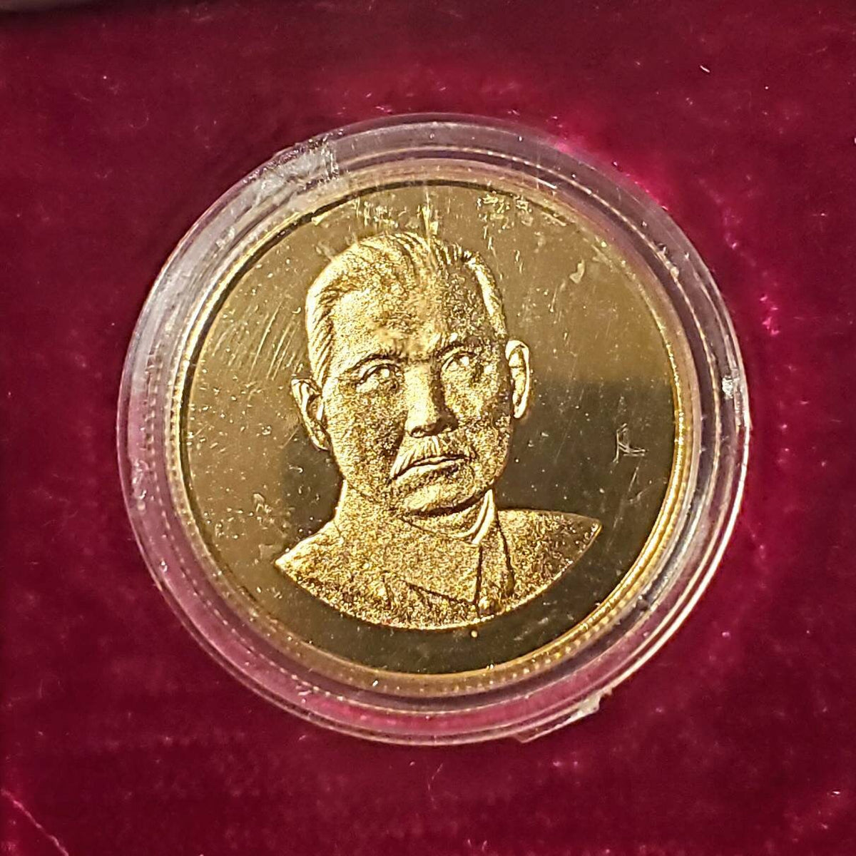 Chinese gilded medal token in souvenir fabric red box