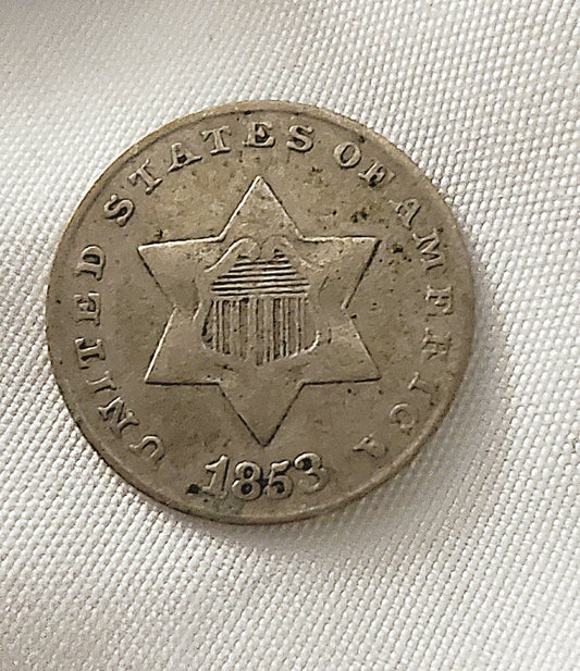 1853 honest to goodness solid three cent silver piece, always popular American coin