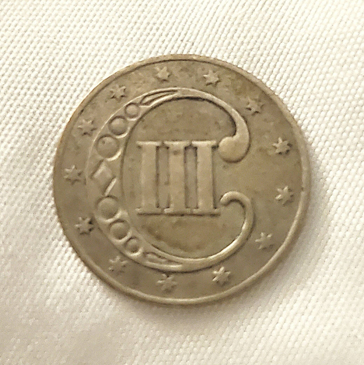 1853 honest to goodness solid three cent silver piece, always popular American coin
