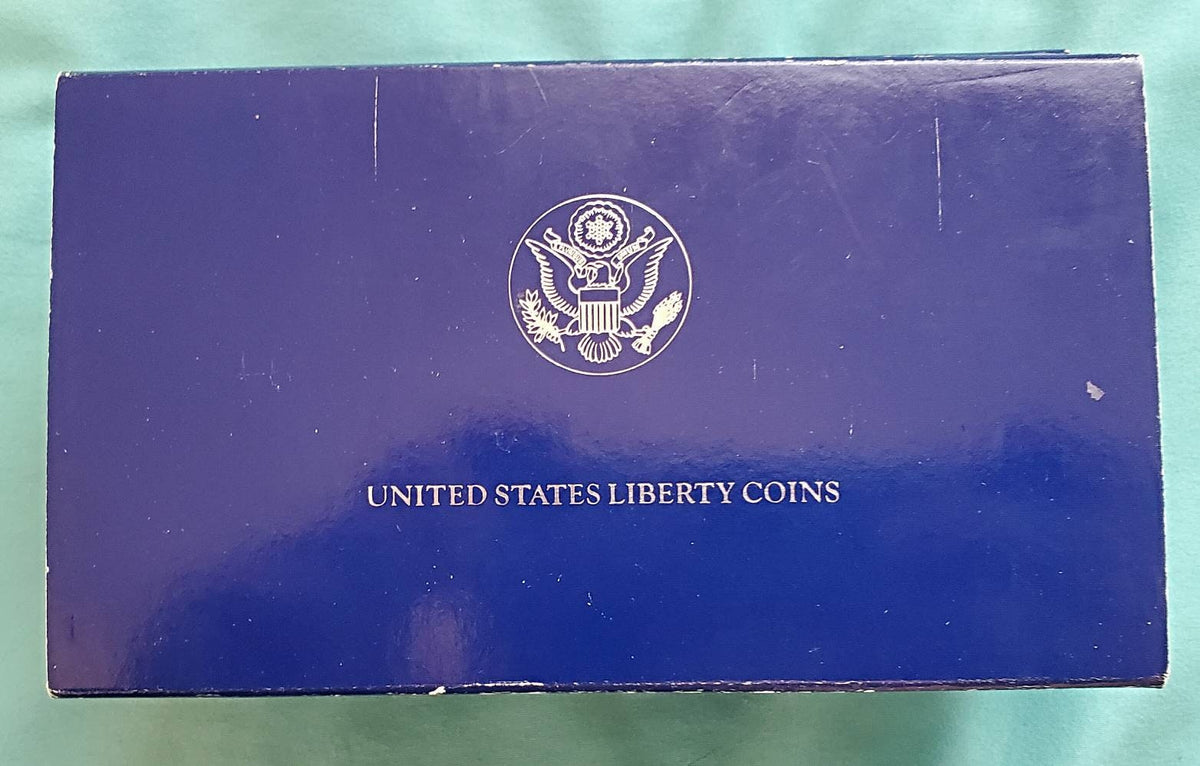 1986s statue of liberty two coin commemorative set including 90 percent silver proof dollar