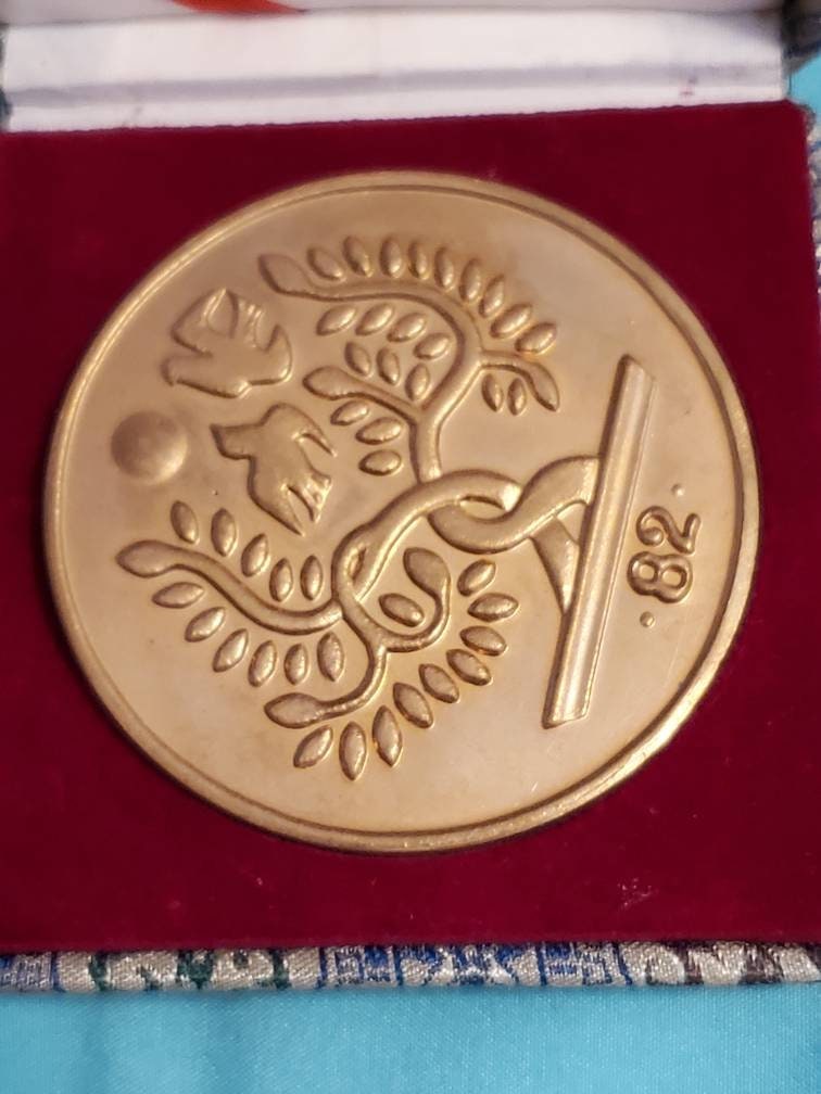 Chinese large gilded token in fabric box
