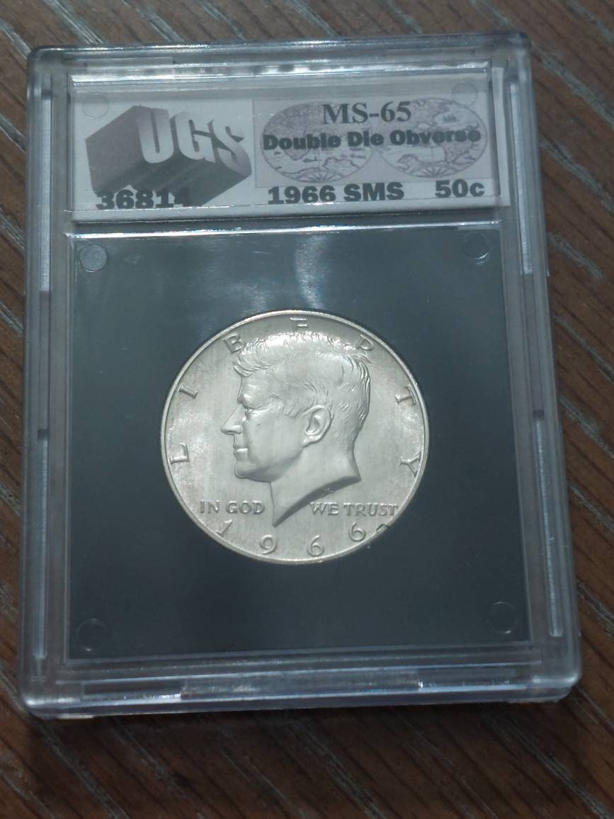 1966 Kennedy half dollar, 40 percent silver coin graded ms65 by third party grader, double profile variety