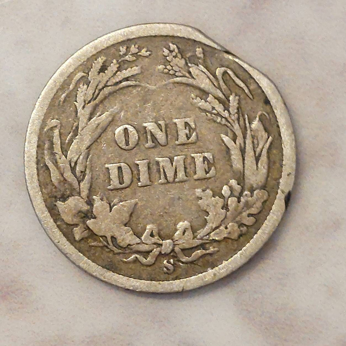 1893s barber silver dime, Scarce early date, a good coin. Planchet flaw or post mint damage I don't know..