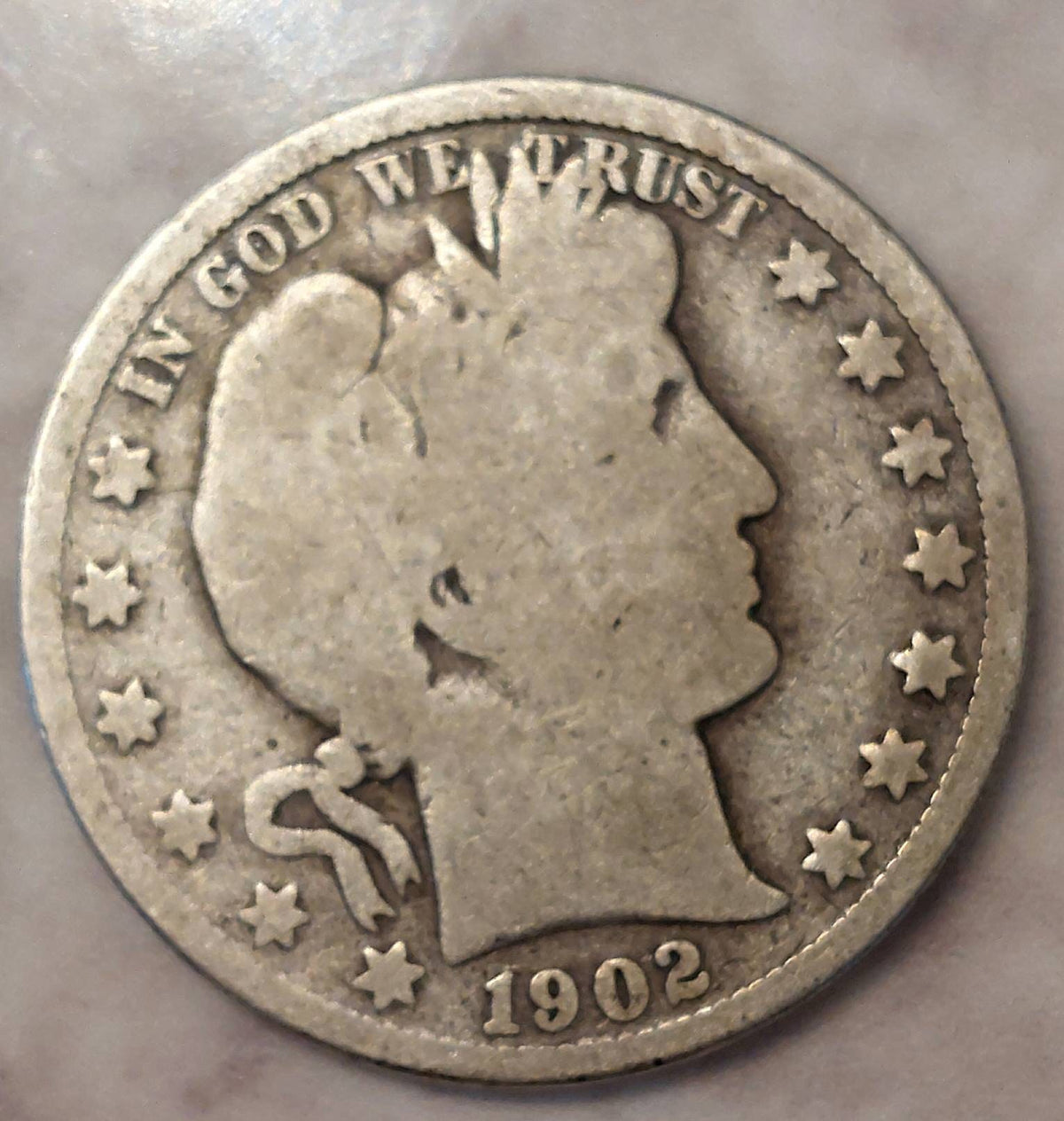 1902o new orleans scarce Barbee half dollar, a good plus coin
