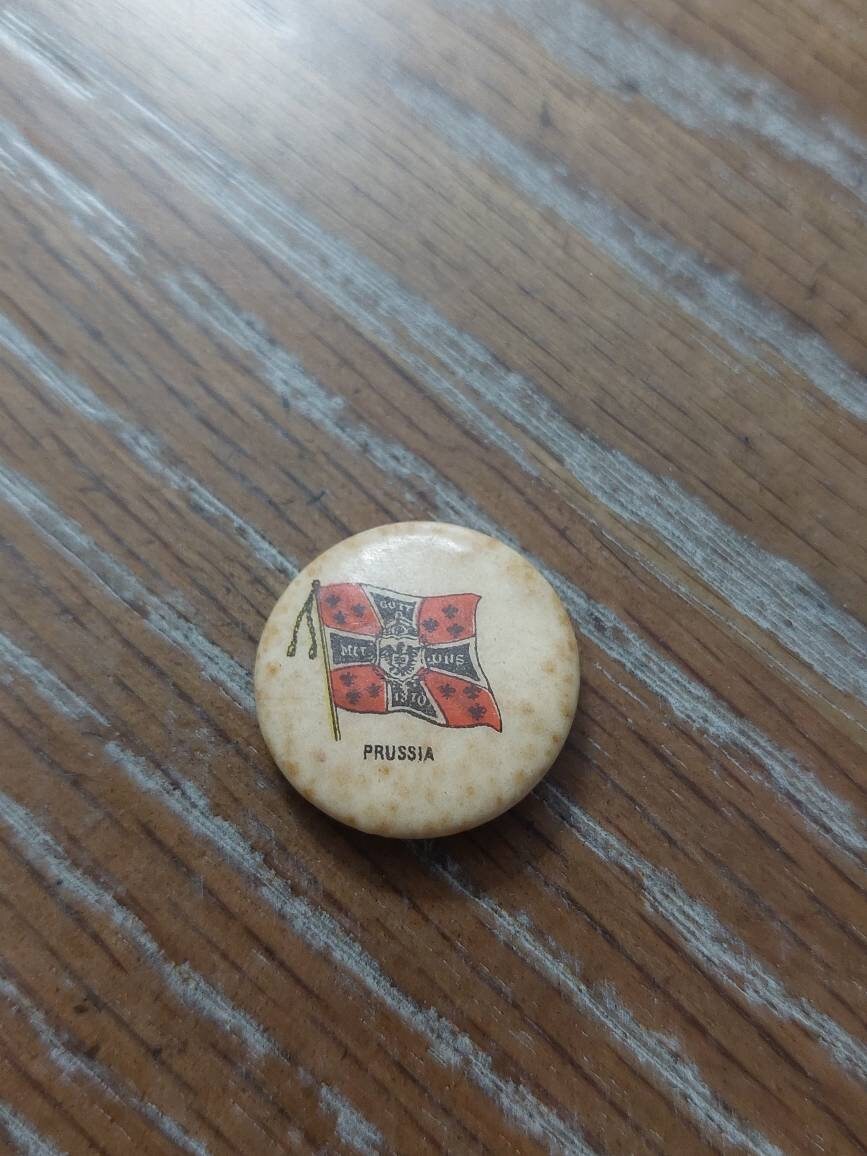 1890s celluloid pinback, advertising token nation of prussia, whitehead and Hoag