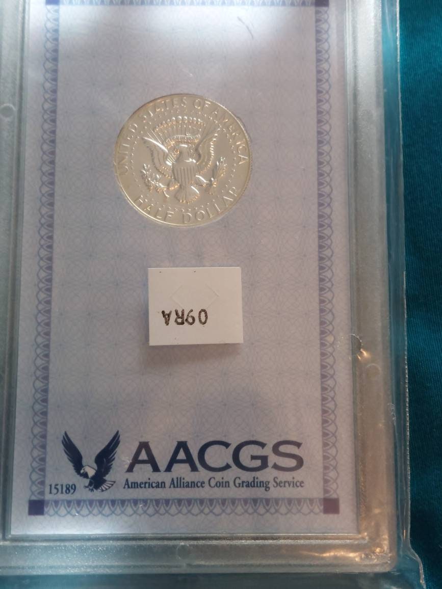 1969s proof Kennedy half dollar, 40 percent silver us coin collecting,  graded proof 69! Near perfect.