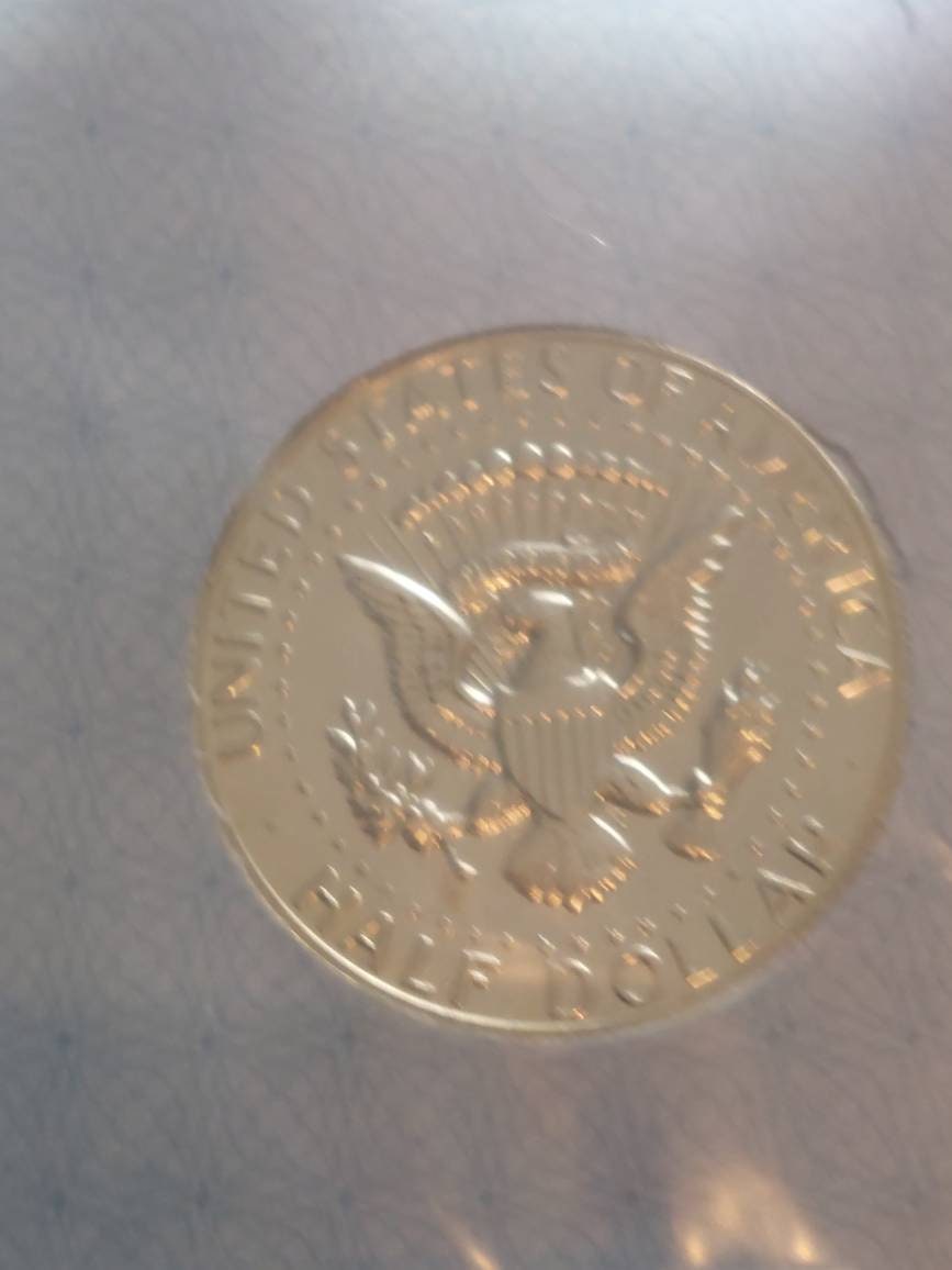 1969s proof Kennedy half dollar, 40 percent silver us coin collecting,  graded proof 69! Near perfect.