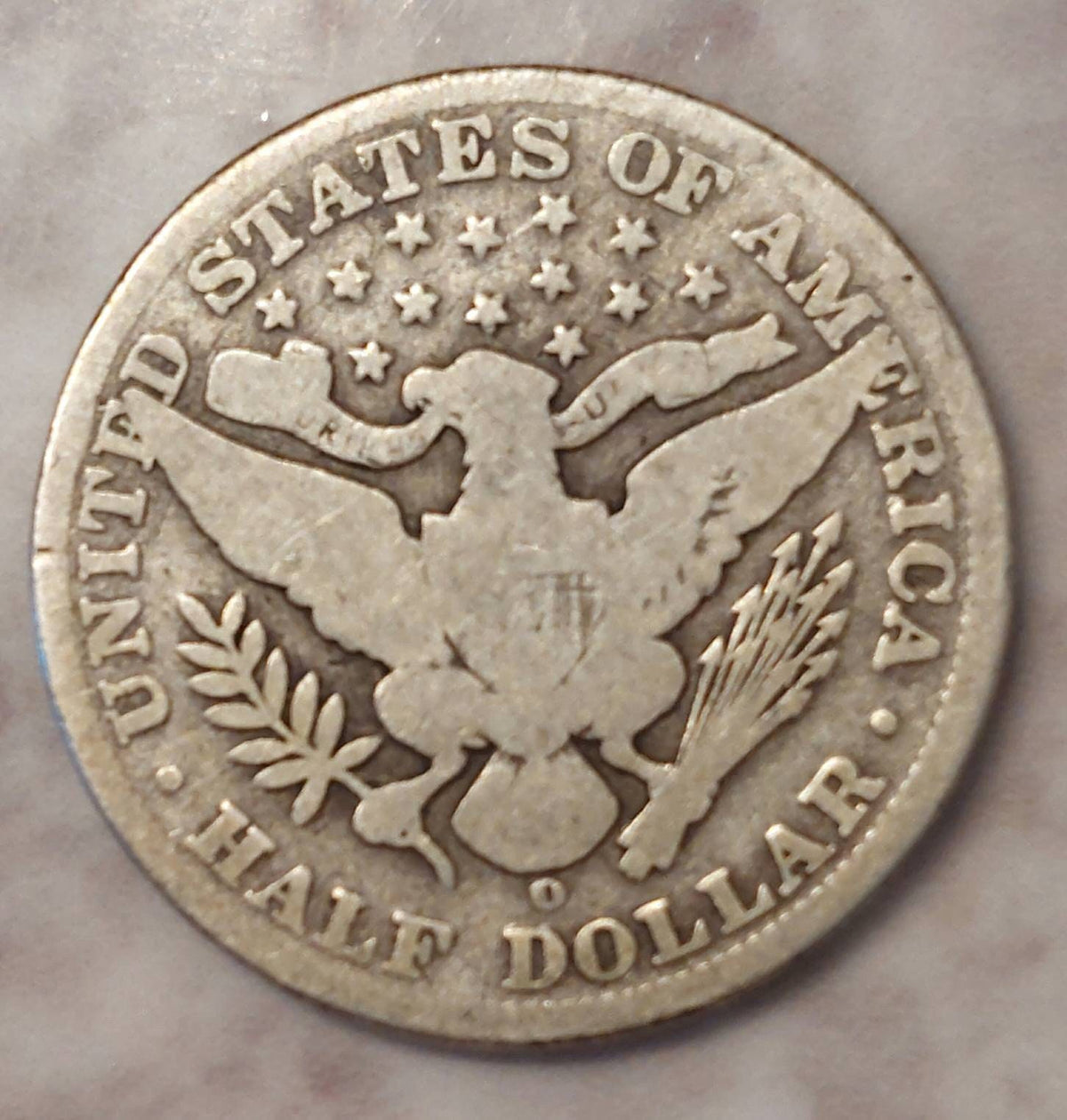 1902o new orleans scarce Barbee half dollar, a good plus coin