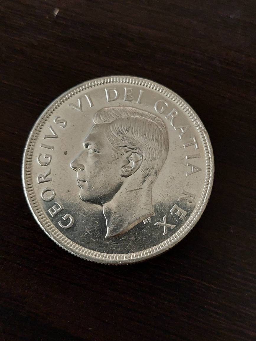 1950 Canadian silver dollar, king george foreign coin in high grade, coin collecting