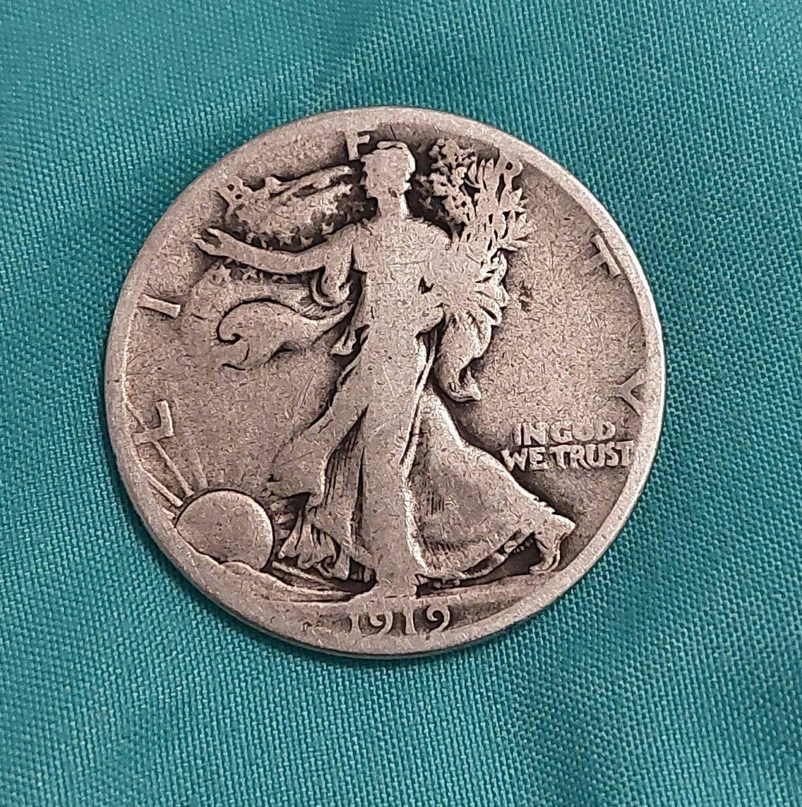 1919s walking liberty silver half dollar better early date