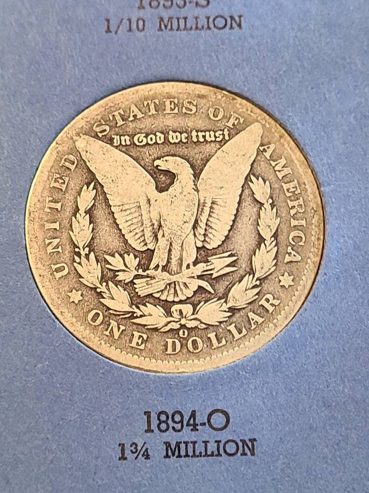 1894o morgan silver dollar semi key date new orleans mint coin, a better date low mintage antique American coin in vintage coin albulm