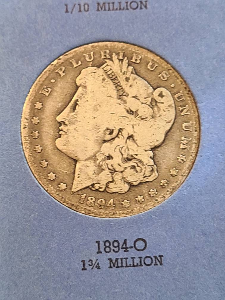 1894o morgan silver dollar semi key date new orleans mint coin, a better date low mintage antique American coin in vintage coin albulm