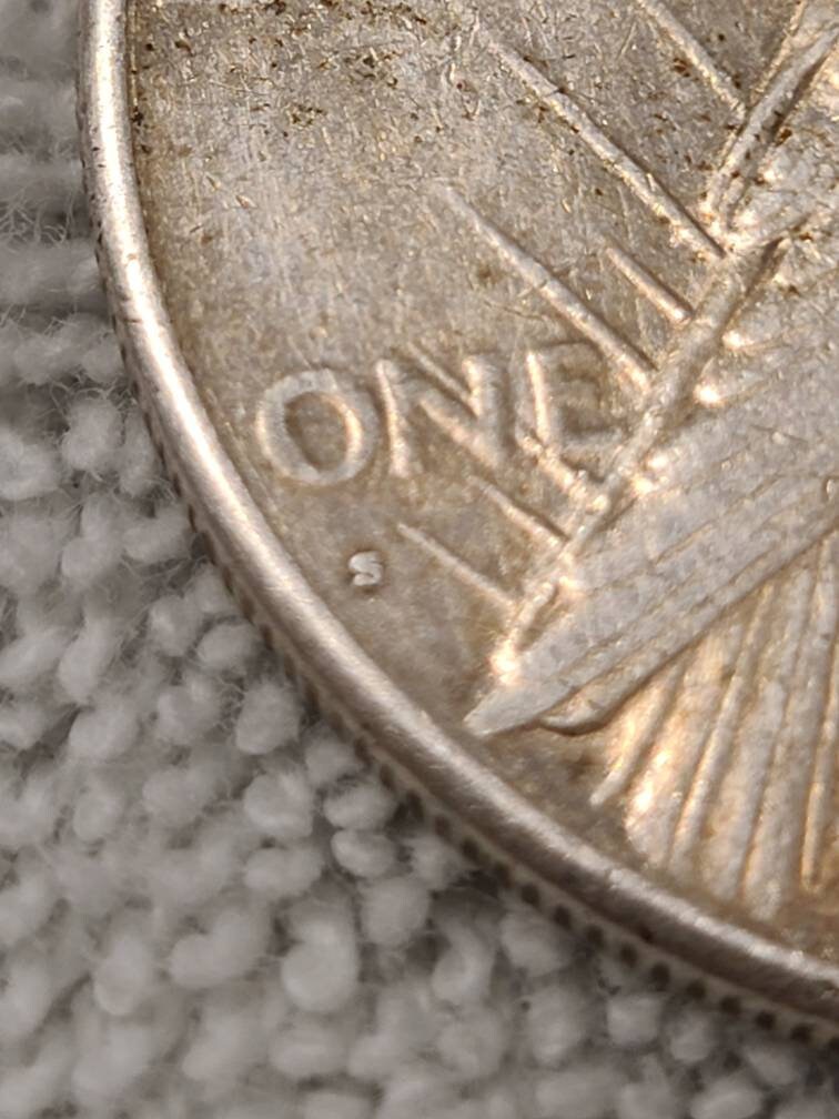 1927s peace dollar, semi key date low mintage 90 percent silver