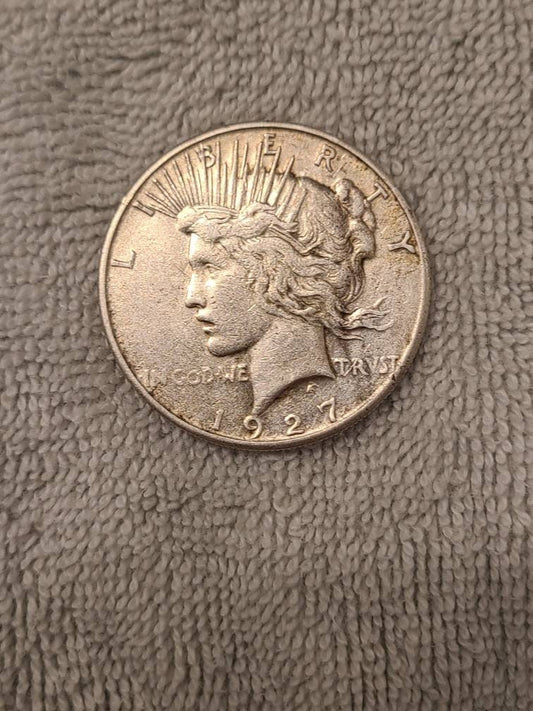 1927s peace dollar, semi key date low mintage 90 percent silver
