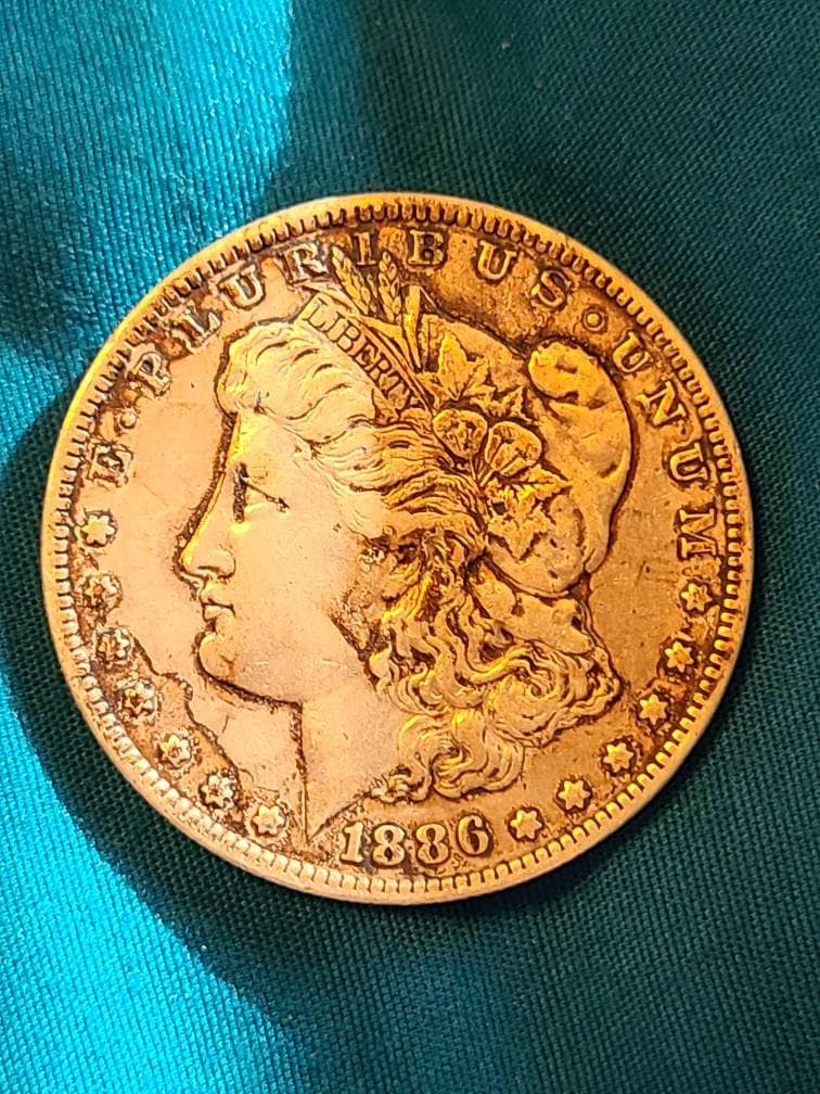 1886o better date morgan silver dollar, rare old new Orleans mint one dollar us coin