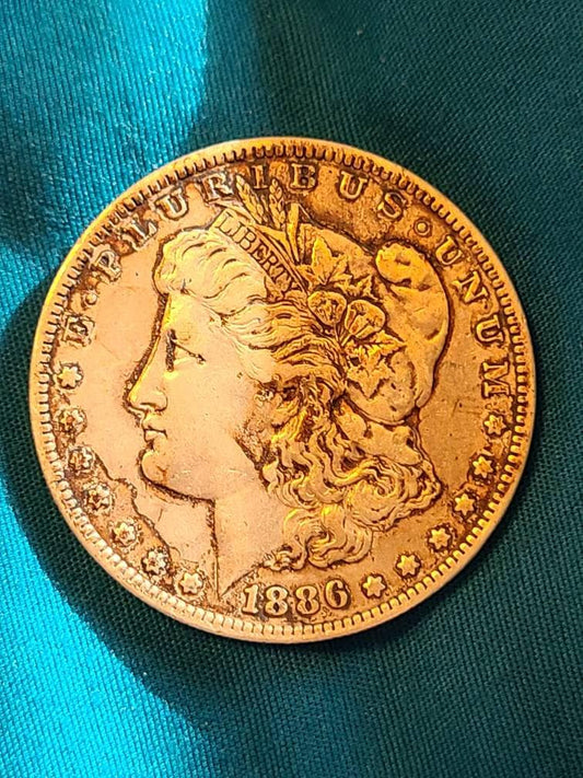 1886o better date morgan silver dollar, rare old new Orleans mint one dollar us coin