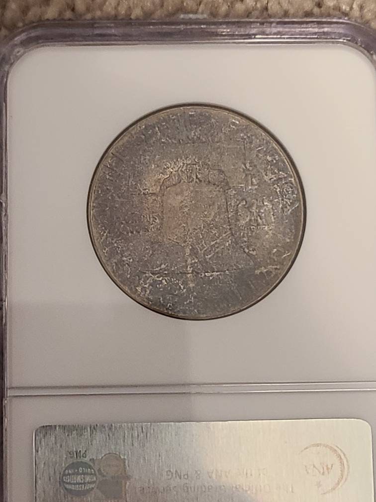 Ben Franklin silver half dollar, 1957p ngc ms65 gem uncirculated graded and toned Franklin half dollar