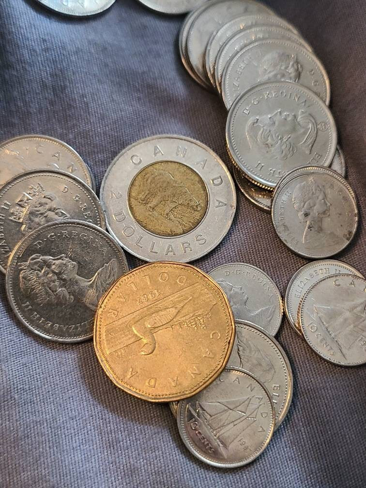 90+ better foreign coin lot, including usable Swiss francs, Canadian,  and even some silver! Happy hunting.  10+ dollars Canadian