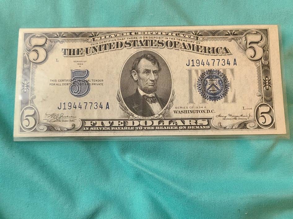 1934a high grade blue seal 5 dollar bill, antique silver certificate bill