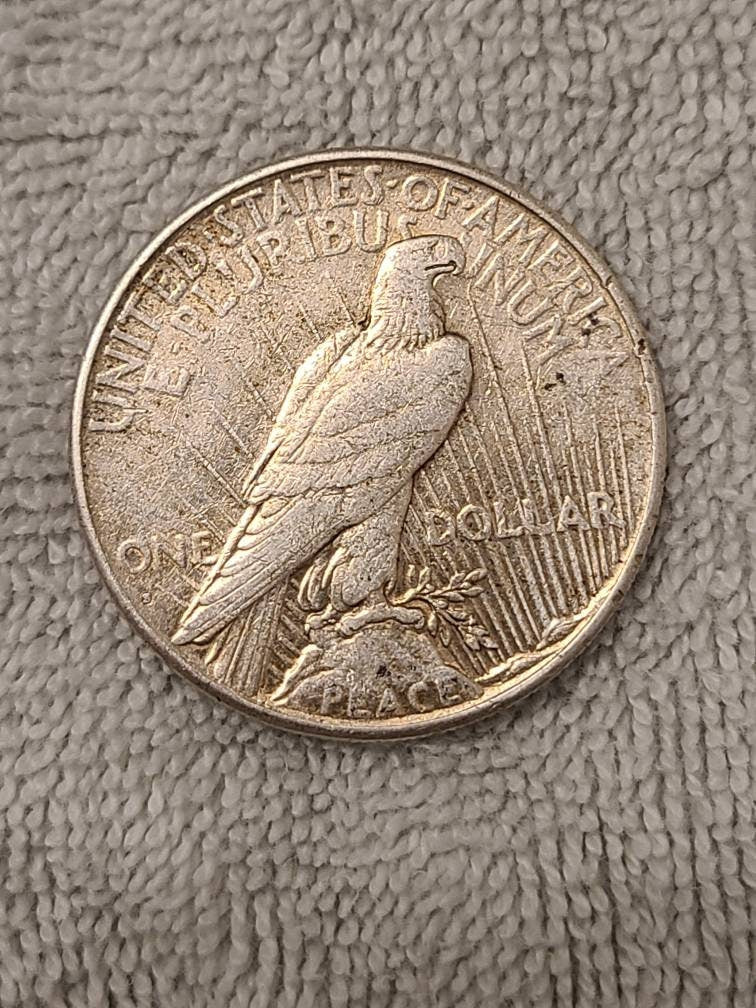 1927s peace dollar, semi key date low mintage 90 percent silver