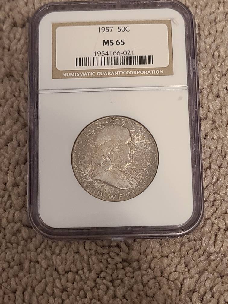 Ben Franklin silver half dollar, 1957p ngc ms65 gem uncirculated graded and toned Franklin half dollar