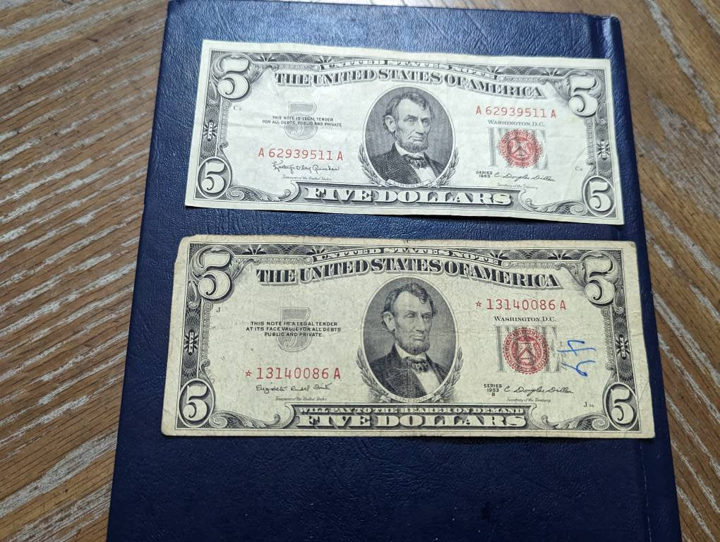 Two 1950s five dollar, one is a star note, red seal notes plus bonus gift